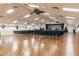 Spacious clubhouse with rows of chairs, a stage, and holiday decor at 11231 Dollar Lake Dr # 6, Port Richey, FL 34668