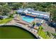 Lakeside community pool with a clubhouse, ample seating, and plenty of parking at 11231 Dollar Lake Dr # 6, Port Richey, FL 34668