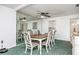 Dining room with a table, chairs, and a large mirror at 11231 Dollar Lake Dr # 6, Port Richey, FL 34668