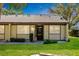 A charming one-story home with a well-maintained lawn and inviting curb appeal is shown at 11231 Dollar Lake Dr # 6, Port Richey, FL 34668