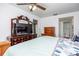 Main bedroom featuring a king-size bed, dresser, and TV at 11231 Dollar Lake Dr # 6, Port Richey, FL 34668