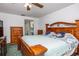 Spacious main bedroom with wooden furniture and ample natural light at 11231 Dollar Lake Dr # 6, Port Richey, FL 34668