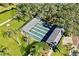 Community shuffleboard courts nestled amid lush green landscaping at 11231 Dollar Lake Dr # 6, Port Richey, FL 34668
