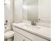 Bright bathroom featuring white vanity, modern faucet, and well-lit mirror at 11726 Renaissance Blvd, Venice, FL 34293