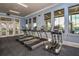 Fitness center equipped with treadmills, elliptical machines, and large windows at 11726 Renaissance Blvd, Venice, FL 34293