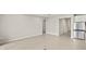 Spacious living area with tile floors, neutral paint, and an open layout at 11726 Renaissance Blvd, Venice, FL 34293