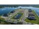 An aerial view of a community with new construction homes surrounding a lake at 11846 Mile Marsh Dr, Riverview, FL 33569