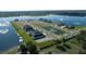 Top-down view of a neighborhood of homes bordering a tranquil lake at 11846 Mile Marsh Dr, Riverview, FL 33569