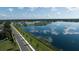An aerial view of homes along a serene lake in a residential community at 11846 Mile Marsh Dr, Riverview, FL 33569