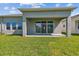 Spacious backyard with a covered patio perfect for outdoor entertaining and relaxation at 11846 Mile Marsh Dr, Riverview, FL 33569