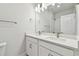 Well-lit bathroom boasts a double vanity with white cabinets and modern fixtures at 11846 Mile Marsh Dr, Riverview, FL 33569