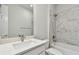 Bright bathroom featuring a marble vanity and a shower-tub combo at 11846 Mile Marsh Dr, Riverview, FL 33569