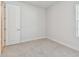 Comfortable bedroom with neutral carpeting, white walls, and natural light at 11846 Mile Marsh Dr, Riverview, FL 33569