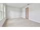 Empty carpeted bedroom with white walls and baseboards, awaits your personal design and decor touches at 11846 Mile Marsh Dr, Riverview, FL 33569