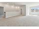 Bright bonus room with large windows, neutral carpet, and recessed lighting at 11846 Mile Marsh Dr, Riverview, FL 33569