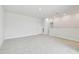 Spacious bonus room is well-lit and has neutral carpet throughout at 11846 Mile Marsh Dr, Riverview, FL 33569