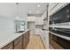 Gourmet kitchen with stainless steel appliances, custom cabinets, and a spacious island at 11846 Mile Marsh Dr, Riverview, FL 33569