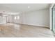 Spacious living room featuring light hardwood floors, recessed lighting, and bright windows at 11846 Mile Marsh Dr, Riverview, FL 33569