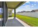 Covered patio offering a view of the lush backyard and neighboring homes at 11846 Mile Marsh Dr, Riverview, FL 33569