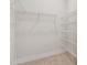 An organized walk-in closet featuring carpet floors and white shelving for storage at 11846 Mile Marsh Dr, Riverview, FL 33569
