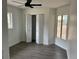 Bedroom featuring vinyl flooring, closet, and windows, providing ample light and storage at 12186 Lamont Dr, Spring Hill, FL 34608