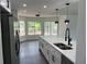 Kitchen featuring updated stainless steel appliances, pendant lights, and a sliding door to the backyard at 12186 Lamont Dr, Spring Hill, FL 34608