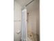 Clean bathroom with a walk-in shower and white tile walls at 1230 Gulf Blvd # 402, Clearwater Beach, FL 33767