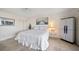 Bedroom with queen-size bed, ceiling fan, and storage cabinet at 1230 Gulf Blvd # 402, Clearwater Beach, FL 33767