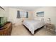 Bedroom with bed, dresser, and TV at 1230 Gulf Blvd # 402, Clearwater Beach, FL 33767