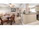 Dining area adjacent to the kitchen with a partial view of stainless steel appliances at 1230 Gulf Blvd # 402, Clearwater Beach, FL 33767