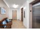 Hallway with elevators, a bench, and beach-themed decor at 1230 Gulf Blvd # 402, Clearwater Beach, FL 33767