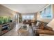 Living room with comfortable seating, ocean views, and entertainment center at 1230 Gulf Blvd # 402, Clearwater Beach, FL 33767