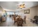 Bright living room with ocean views, comfortable seating, dining area, and ceiling fan at 1230 Gulf Blvd # 402, Clearwater Beach, FL 33767