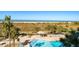Inviting pool area with boardwalk to beach at 1230 Gulf Blvd # 402, Clearwater Beach, FL 33767