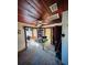 Dining room with wood ceiling, table, and doorway to sunroom at 13318 2Nd E St, Madeira Beach, FL 33708