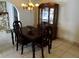 Formal dining room with chandelier and china cabinet at 1713 Grand Central Dr, Tarpon Springs, FL 34689