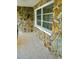 Stone exterior wall with a large window at 1713 Grand Central Dr, Tarpon Springs, FL 34689