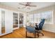 Home office with built-in shelving and hardwood floors at 1714 58Th S St, Gulfport, FL 33707