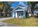 Blue two-story home with a front porch and attached garage at 1723 W Palmetto St, Tampa, FL 33607