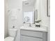 Modern bathroom with a vanity, white countertop, and gray cabinets at 17451 Whiskey Creek Trl, Parrish, FL 34219