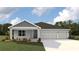 Single-story home with two-car garage and landscaped front yard at 17455 Whiskey Creek Trl, Parrish, FL 34219
