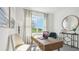 Well-lit home office boasts a functional workspace and stylish decor at 17463 Whiskey Creek Trl, Parrish, FL 34219