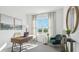 Inviting home office space with ample natural light, a sleek desk, and comfortable seating at 17463 Whiskey Creek Trl, Parrish, FL 34219