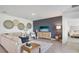 The open-concept living room features stylish decor and access to the main bedroom at 17463 Whiskey Creek Trl, Parrish, FL 34219