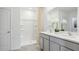 Primary bathroom with double vanity, large shower, and modern fixtures at 17463 Whiskey Creek Trl, Parrish, FL 34219