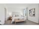 Spacious Primary bedroom with upholstered headboard, nightstands, and a bench at 17463 Whiskey Creek Trl, Parrish, FL 34219