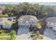 Two-story house with a three-car garage and large backyard at 2212 Valterra Vista Way, Valrico, FL 33594