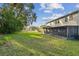 Large backyard with screened patio and plenty of green space at 2212 Valterra Vista Way, Valrico, FL 33594