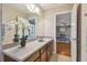 Bathroom with vanity, mirror and view of bedroom at 2212 Valterra Vista Way, Valrico, FL 33594