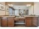 Double vanity bathroom with granite countertops and ample storage at 2212 Valterra Vista Way, Valrico, FL 33594